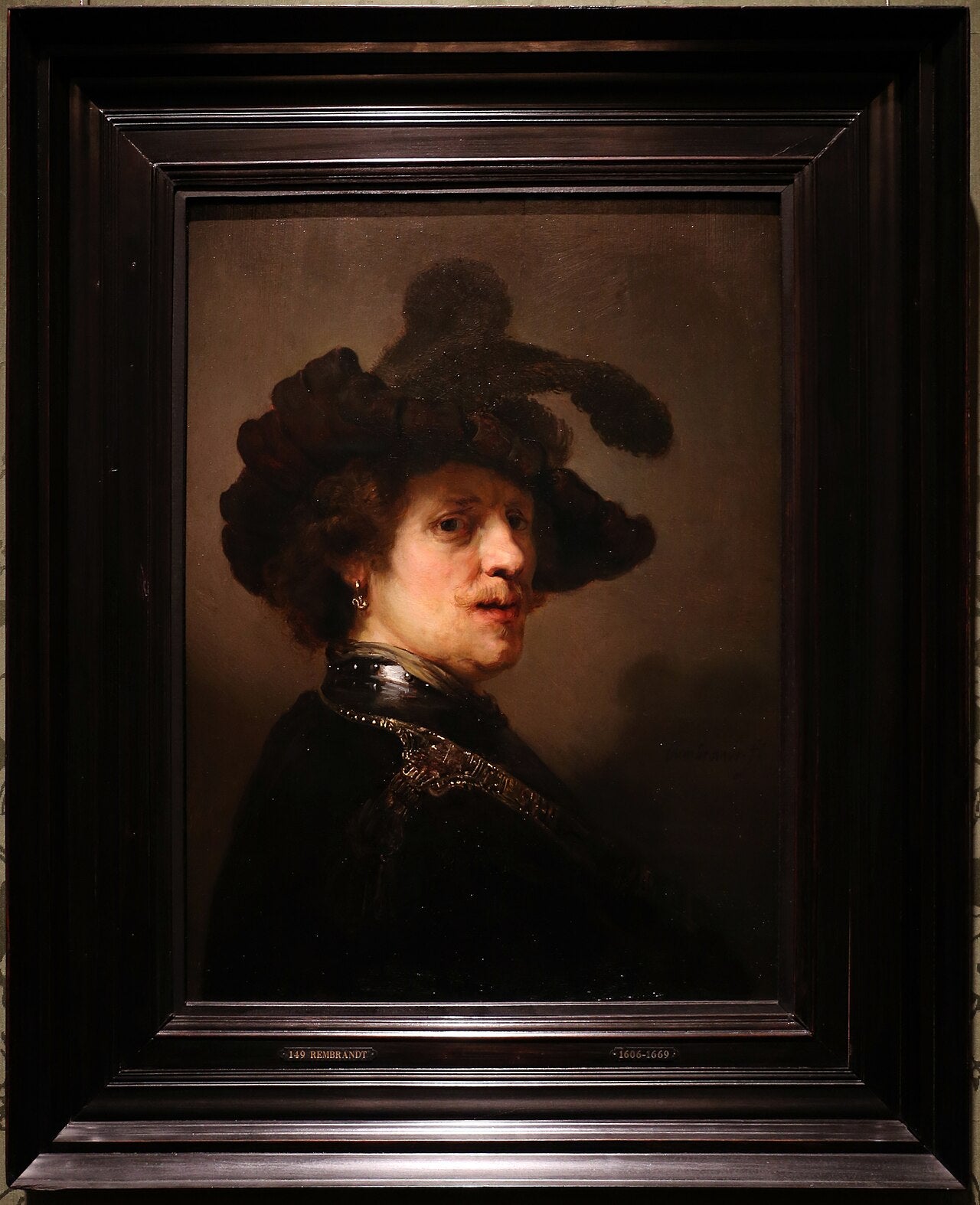 Tüy şapka takan Adam - Rembrandt