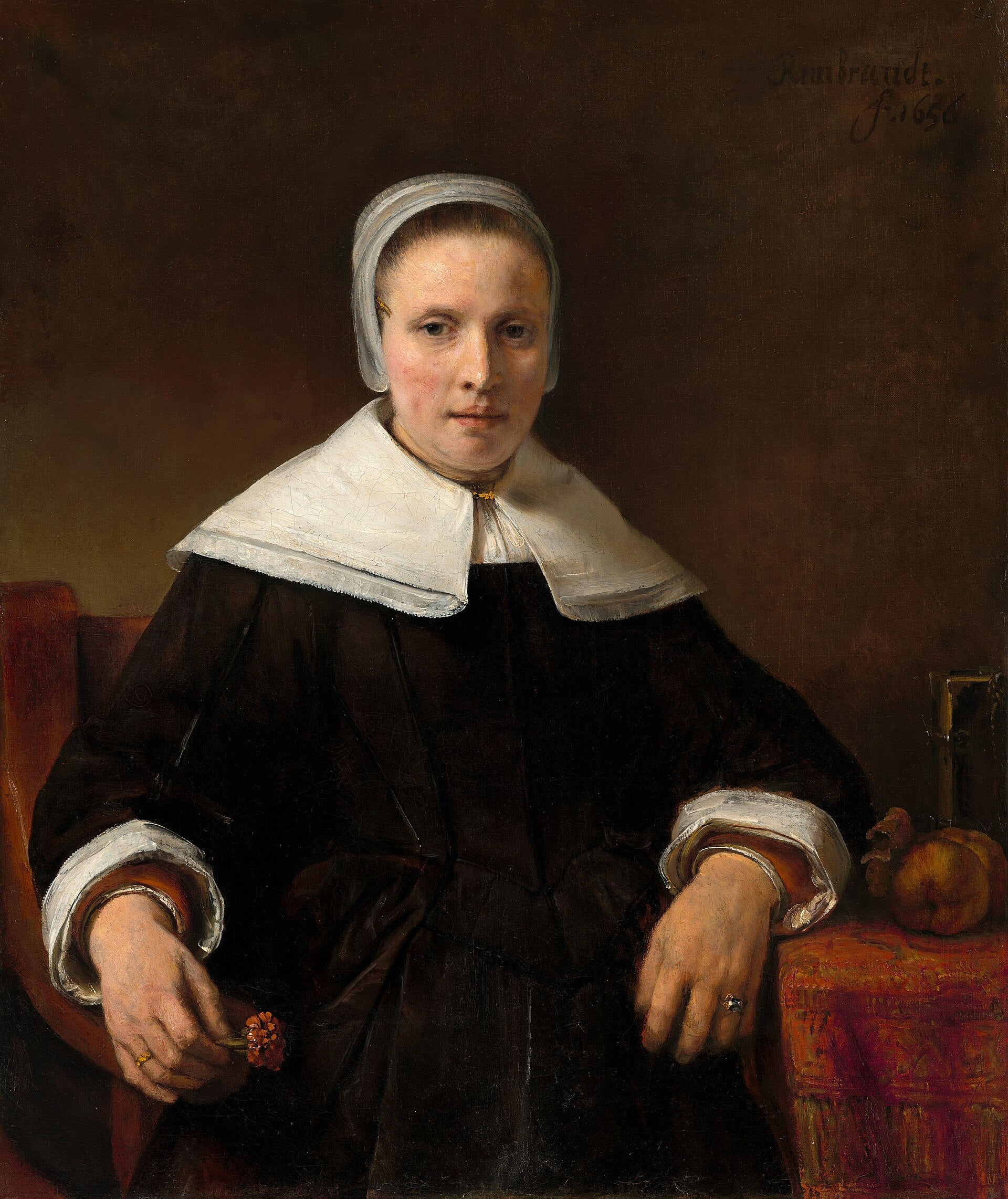 Reproduction du tableau « Une femme tenant une rose - Rembrandt » par Alpha Reproduction en peinture à l’huile