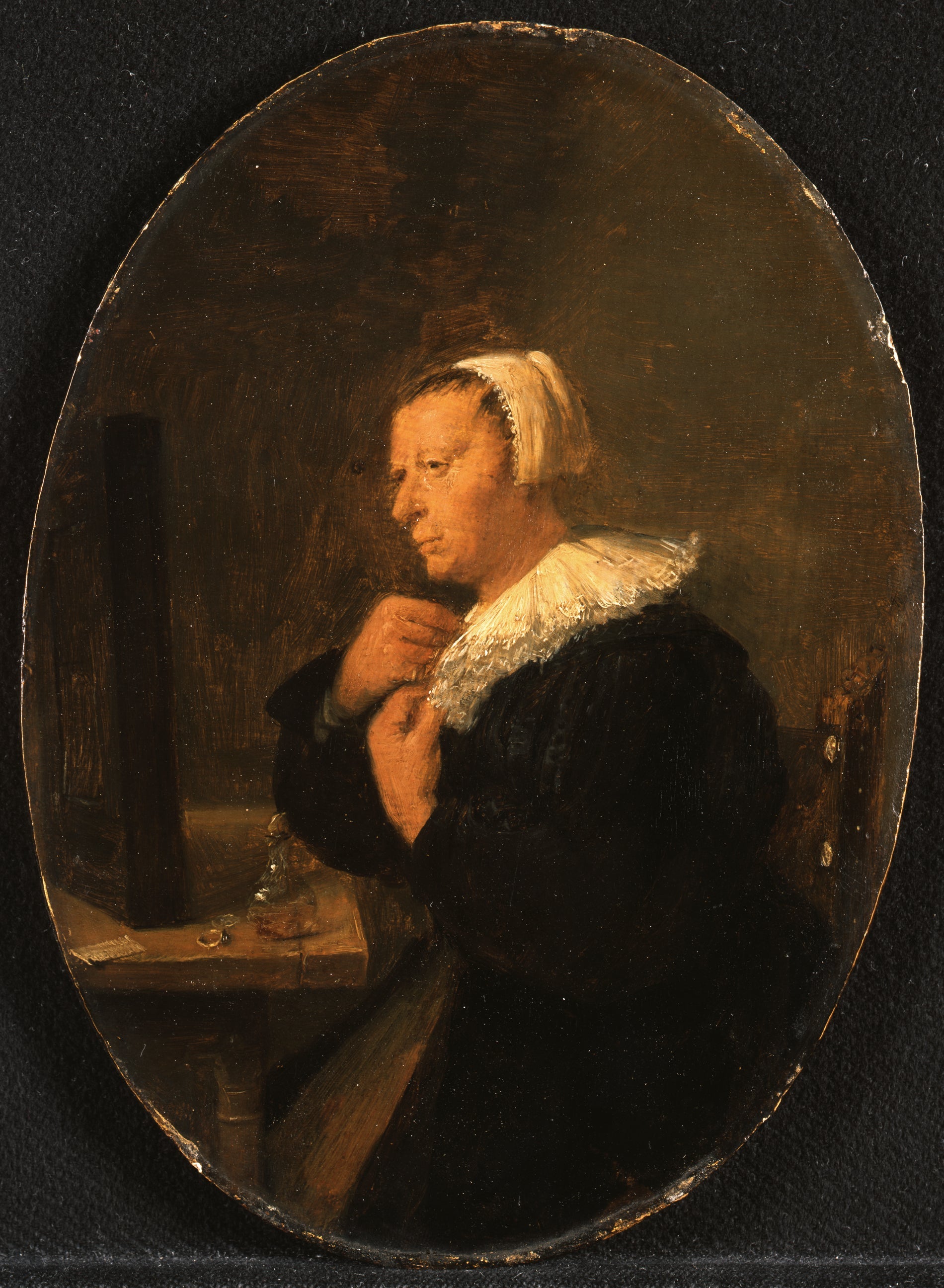 Femme assise à une table devant un miroir (se préparant) - Adriaen Brouwer image 1 reproduction artisanale de tableau