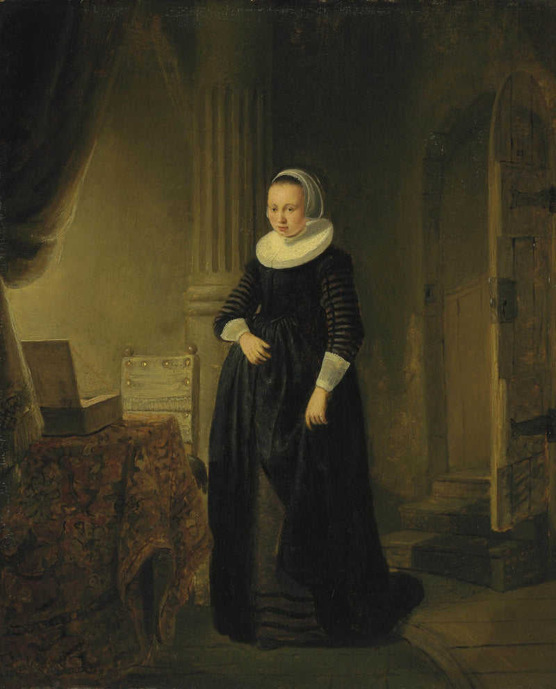 Bir kadının portresi, ayakta bir iç mekanda - Rembrandt