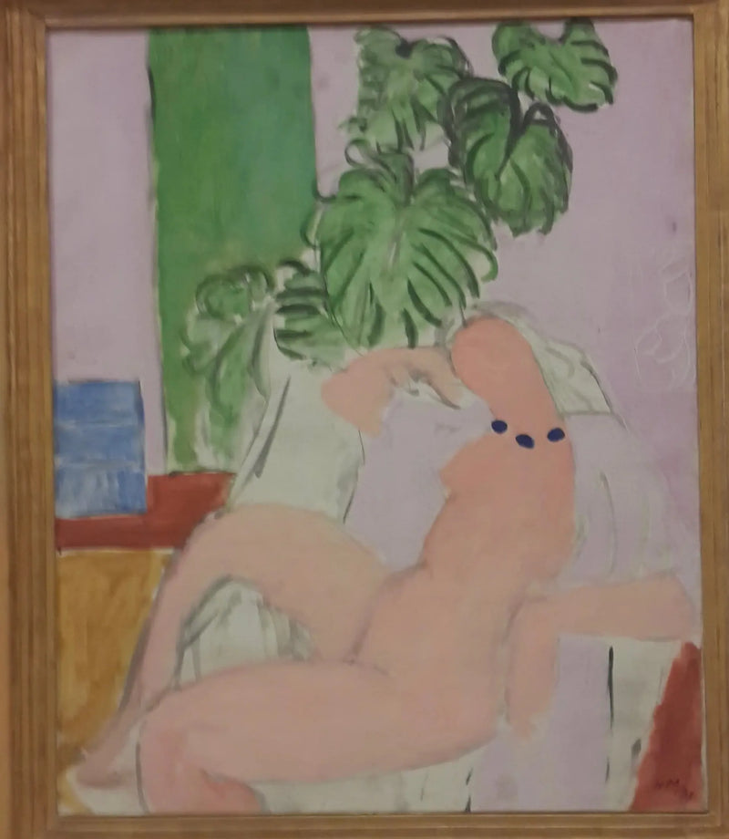 Yeşil bitki ile bir koltukta oturan - Henri Matisse