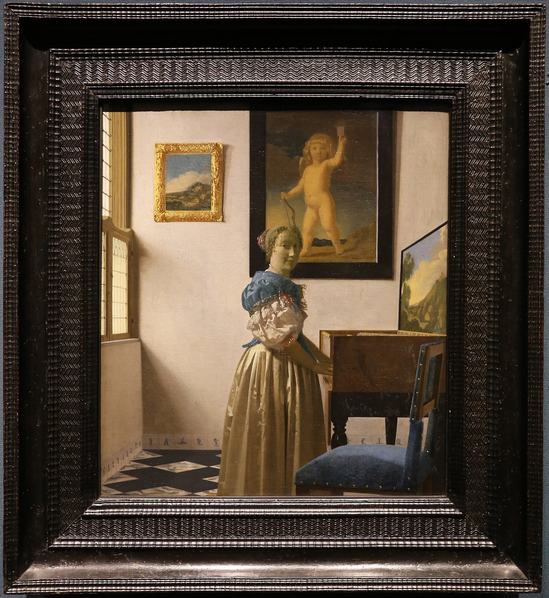 Bir kadın virginalin başında - Johannes Vermeer